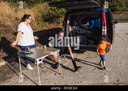 Family man with prosthetic leg playing outdoors Stock Photo