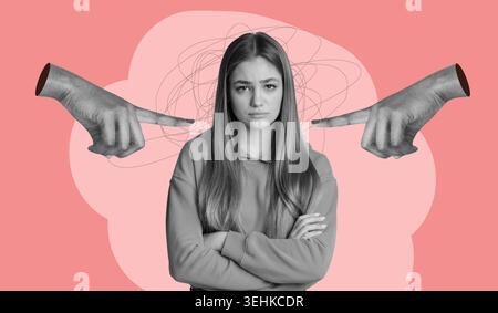 A Young Woman Stands With Crossed Arms and a Serious Face Stock Photo