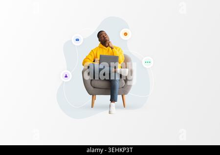 Person Sitting in Chair Thinking While Using Laptop With Icons Around Them Stock Photo