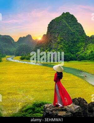 Asian woman wearing Vietnam culture traditional at Tam coc, Vietnam. Stock Photo