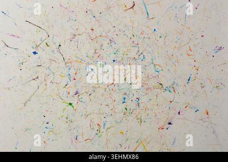 multicolored wax crayon scribbles on white paper, overlapping lines and vivid drawing marks, full frame background texture, childhood education Stock Photo