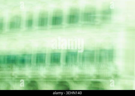 Soft green abstract motion blur background with a subtle grid and layered translucency, creating a calm modern texture for banners, presentations, and Stock Photo
