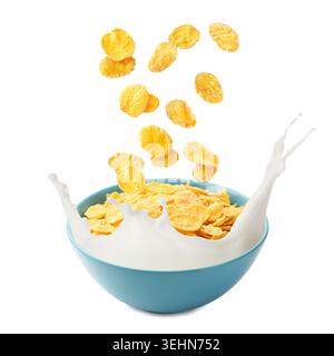 Corn flakes falling into bowl with milk splash on white background Stock Photo