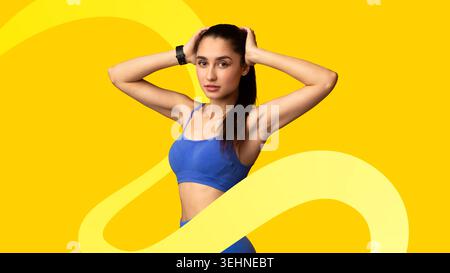 Young Woman Poses Confidently With Hands on Her Head in Bright Setting During Fitness Session Stock Photo