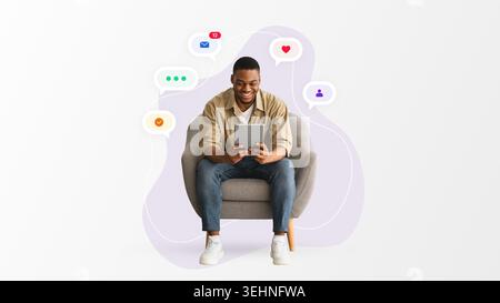 Man Sitting in Chair Using Tablet While Interacting With Social Media Icons Stock Photo