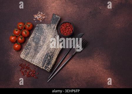 Food, Empty rectangular wooden cutting board on textured concrete background. Cooking at home Stock Photo