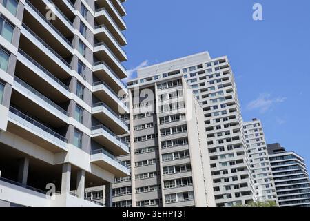 Modern high rise apartment building with rows of balconies and large ...