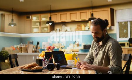 Independent worker monitoring AI machine learning systems on laptop, neural networks and generative models with artificial intelligence. IT automation for productivity, internet of things. Stock Photo