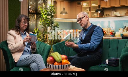Aged retired man, daily prescribed pills, medical treatment, dosage and administration, taking their medicine for disease prevention and vitality. People taking vitamins, in-home healthcare. Stock Photo