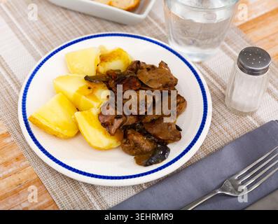 Fried rabbit liver served with boiled potato Stock Photo