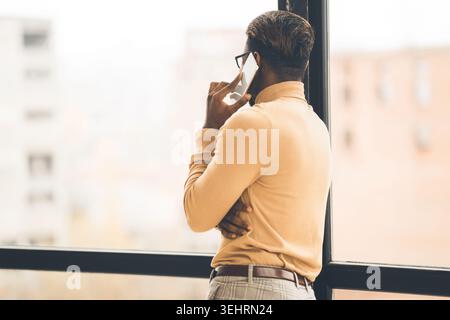 Unrecognizable afro man talking on the phone Stock Photo