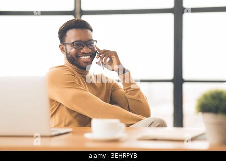 Happy afro student talking on the phone Stock Photo