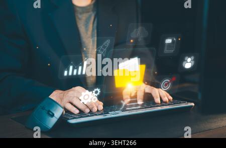 Document management system (DMS) and cloud storage concept. Businessman using laptop for digital file organization, online database infrastructure, an Stock Photo
