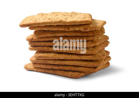 stack of rectangular brown baked crackers isolated white background, crunchy wheat flour biscuits, side view with shadow Stock Photo