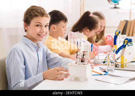Students Engage in Hands On Learning With Robotics Projects in Classroom Setting Stock Photo