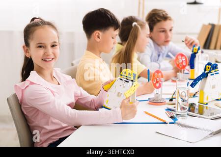 Children Engaged in Creative Robotics Project at a Bright Classroom During Daytime Stock Photo