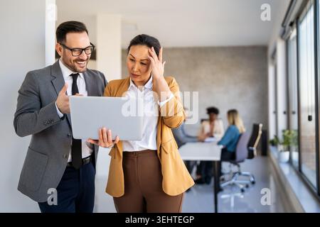 Team of programmers writing digital code in the metaverse and working together on the internet Stock Photo