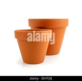 Empty terracotta flower pots, clay garden vase, brown ceramic plant container, terra cotta flowerpot, garden pottery earthenware on white background Stock Photo