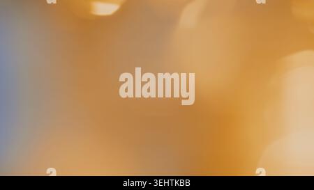 Soft pink to warm gold gradient creates an elegant and subtle aesthetic background. Stock Photo