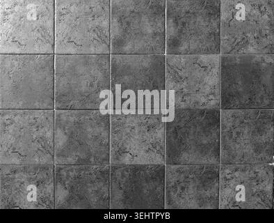 Natural stone tiles, square shape with shades of gray colors . Full frame, background and texture. Stock Photo