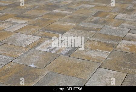 Brown and gray concrete paver blocks of different shapes. Stone effect for outdoor flooring, backyard or sidewalk. Background and texture Stock Photo