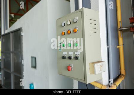 Reliable control panel electrical box showing industrial switch button features managing power inside factory equipment facility providing secure mach Stock Photo