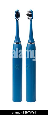 Two blue electric toothbrushes standing upright on a clean white background Stock Photo