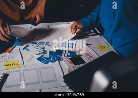 UXUI design brainstorming session with sketches and digital tools Stock Photo