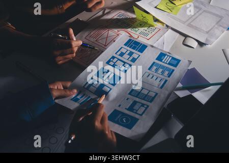 UXUI design brainstorming session with sketches and digital tools Stock Photo