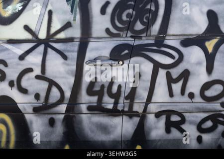 Graffiti Spray Paint on Car Door Stock Photo