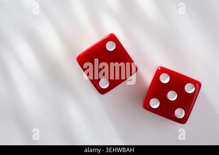 Two red dice on white background Stock Photo