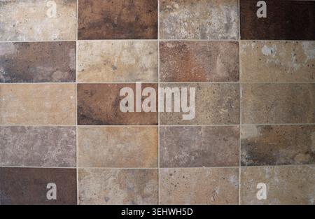 Old weathered  earthenware floor with multicolored large rectangle tiles. Background and texture. Stock Photo