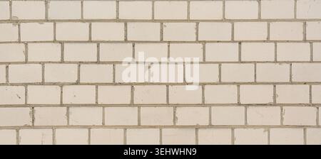 Old white brick wall texture background. Silicate brick blocks wall bg, ancient bricks fence, retro stonewall with copy space, grey brickwork exterior Stock Photo