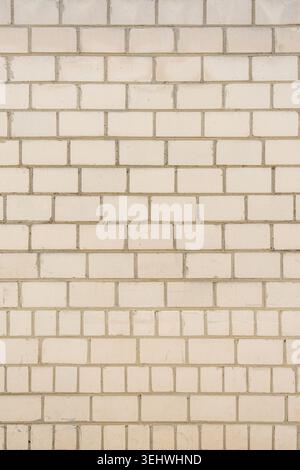 Old white brick wall texture background. Silicate brick blocks wall bg, ancient bricks fence, retro stonewall with copy space, grey brickwork exterior Stock Photo