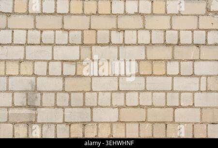 Old white brick wall texture background. Silicate brick blocks wall bg, ancient bricks fence, retro stonewall with copy space, grey brickwork exterior Stock Photo