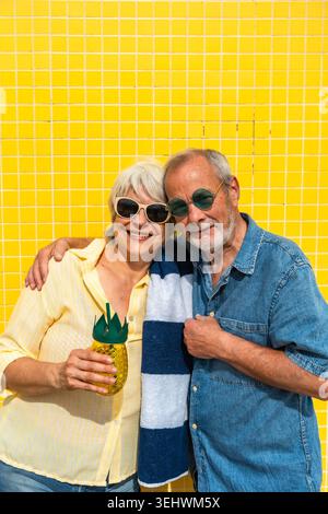 Senior couple sharing a happy tropical vacation moment Stock Photo