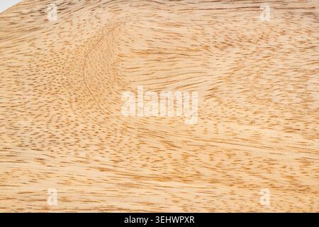 Mango wood texture bg top view. Kitchen wooden tray background, organic Mangifera indica veneer pattern, mango timber board surface close up Stock Photo