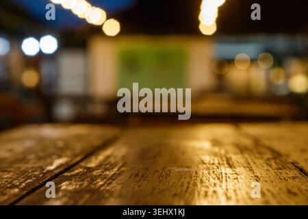 Blurred Background of Wooden Table with Bokeh Lights. Blurred Background. moody atmosphere. bokeh background. High quality photo Stock Photo