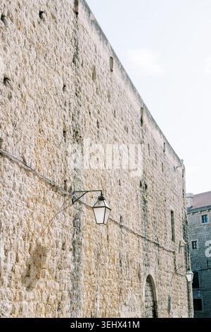 Photographer capturing detailed views of aged stone structures in narrow passageways Stock Photo