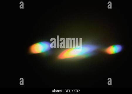 Abstract colorful light refracting, creating vibrant spectrum effect on dark background Stock Photo