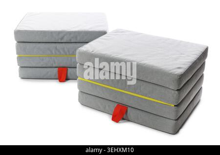 Stylish grey folding mattress isolated on white Stock Photo