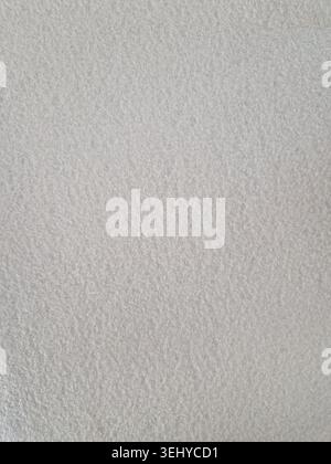 Light grey felt fabric showing a soft, coarse texture surface, providing a neutral background for design, advertising, and textile-related concepts Stock Photo
