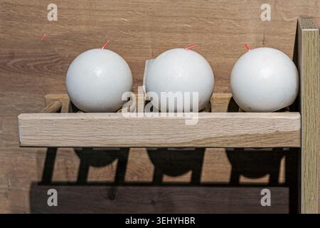 Decorative scented candles on wooden shelves Stock Photo