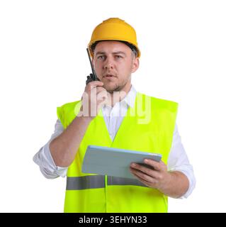 Man in helmet with tablet using walkie talkie on white background Stock Photo