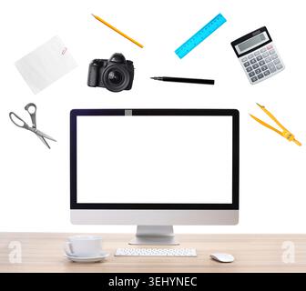 Web design tools flying around computer. Creative designer workspace Stock Photo