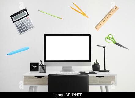 Web design tools flying around computer. Creative designer workspace Stock Photo