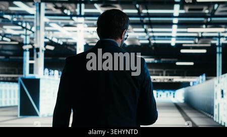 Writing code, tablet closeup and engineer in data center compiling software patches to fix bugs. Running programming script, device application and IT professional in server farm, camera B Stock Photo