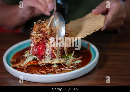wonton cracker with fresh tuna cubes and fried onions with celery and garlic cream. Stock Photo