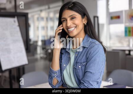 Businesswoman enjoy pleasant personal or business-related conversation on smartphone Stock Photo