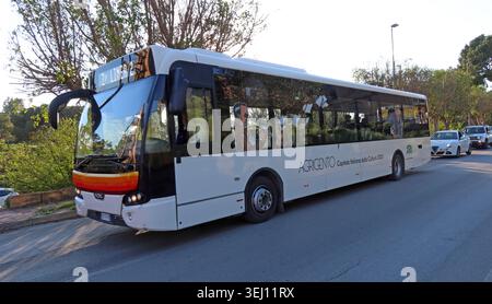 TUA urban bus in Agrigento branded for Agrigento Italian Capital of Culture, Sicily, Italy, front three-quarter view. Stock Photo